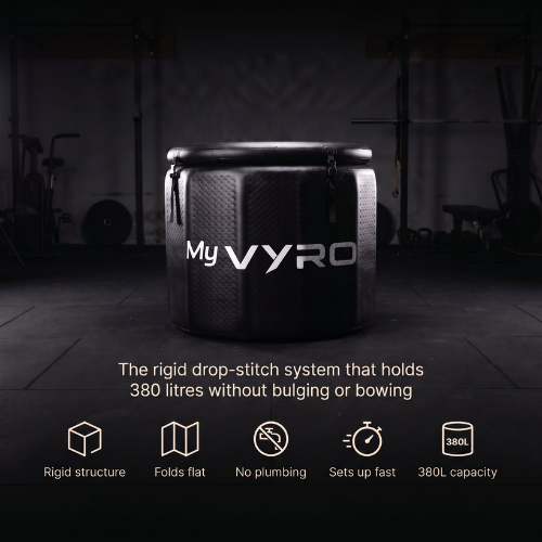 A black inflatable ice bath with the brand name MyVYRO printed in white on the front, set against a dark gym background. Below the bucket, text highlights its rigid drop-stitch system, 380 litres capacity, and key features like folding flat and quick setup.