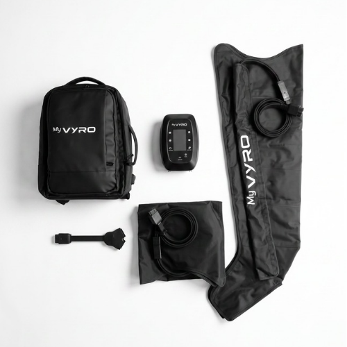 MyVyro compression boots kit laid out on a white background, including a black backpack, electronic controller, boots, and connector cable.